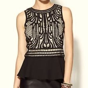 Boutique- purchased, black and tan peplum-style tank.